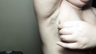 Ellie shows her bushy armpits and plays with them