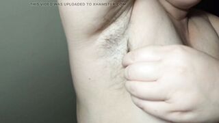 Ellie shows her bushy armpits and plays with them