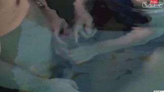 Japanese schoolgirls give swim coach underwater head