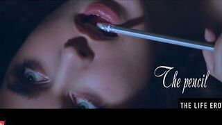 Rubbing her long puffy nipples as she fucks herself with a pencil