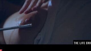 Rubbing her long puffy nipples as she fucks herself with a pencil