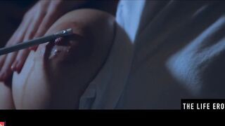 Rubbing her long puffy nipples as she fucks herself with a pencil