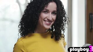 Petite curly teen posed in the kitchen