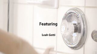 Leah Gotti steps in the shower and turns on the warm water. She takes her time soaping up beneath the