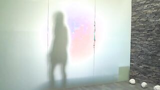 Alexis Brill hoses herself off in the pool shower before carefully stepping to the changing room where she slips on