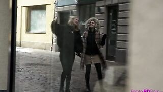 Elza A and her mistress Lesya walk the streets hand inside hand as they enjoy some sightseeing. They stop in