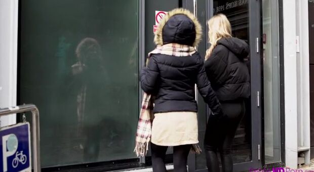 Elza A and her mistress Lesya walk the streets hand inside hand as they enjoy some sightseeing. They stop in