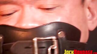 Tied up Asian man is tormented as he is unable to get free