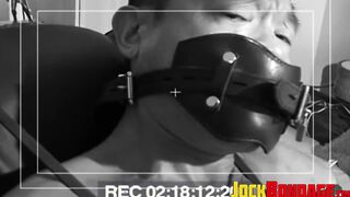 Tied up Asian man is tormented as he is unable to get free