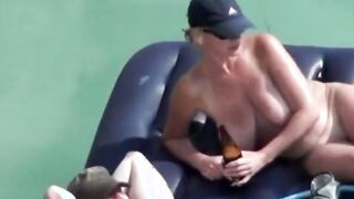 my mom floats on a mattress with dangling tits