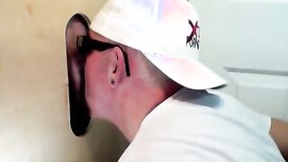 Horny dude with glasses enjoys in a glory hole scene