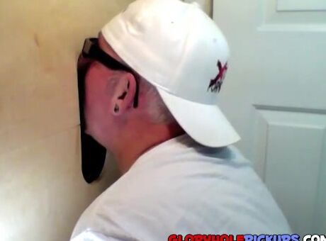 Horny dude with glasses enjoys in a glory hole scene