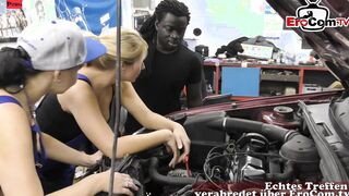 2 bimbos share a big black cock inside a vehicle workshop banged