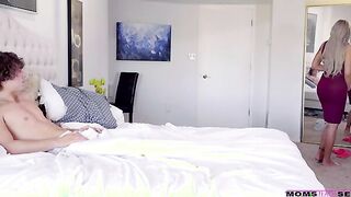 Rion King is in bed chatting on the phone with a friend when his stepmom Nina Elle comes in his