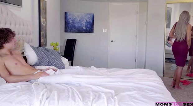 Rion King is in bed chatting on the phone with a friend when his stepmom Nina Elle comes in his