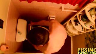 Devin Reynolds grabs his cock and unloads in the toilet|