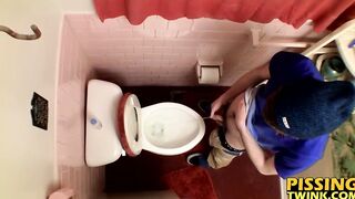 Devin Reynolds grabs his cock and unloads in the toilet|
