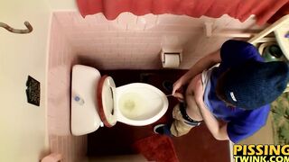 Devin Reynolds grabs his cock and unloads in the toilet|