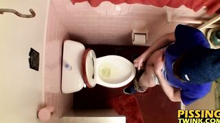 Devin Reynolds grabs his cock and unloads in the toilet|