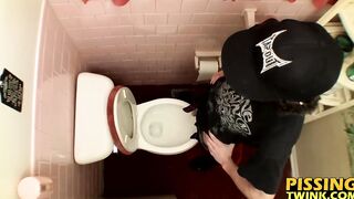 Devin Reynolds grabs his cock and unloads in the toilet|