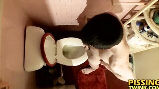 Devin Reynolds grabs his cock and unloads in the toilet|