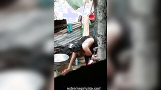 an outdoor wash of a rural Indian mom