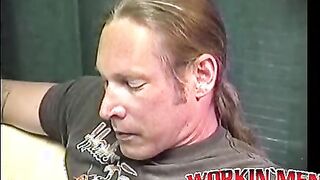Stud Freddyz with long hair strokes his fat meat on a bed