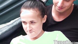 Naughty teen shared by two dicks during a camping trip