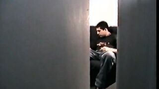 Zack unzips his pants and starts to massage his cock