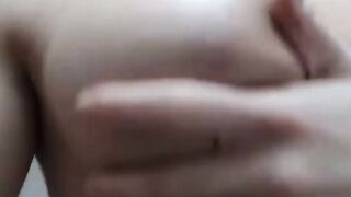 Sexy Chick oils up her big tits and ass