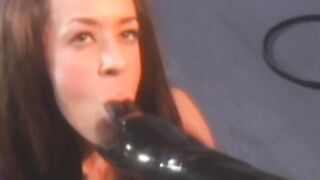 Lesbian babe submits her pussy to latex dominatrix
