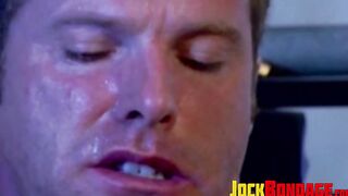 Submissive man struggles while in chains and dominated