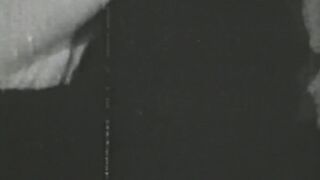 Black and white vintage video of lady sucking her lover