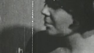 Black and white vintage video of lady sucking her lover