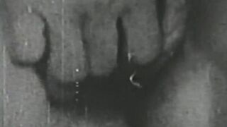 Black and white vintage video of lady sucking her lover
