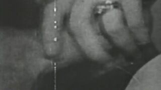 Black and white vintage video of lady sucking her lover