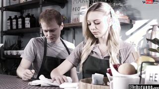 Slim blonde help customer while shes rimmed behind counter