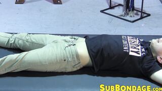 Petite slave restrained for rough BDSM tormenting session