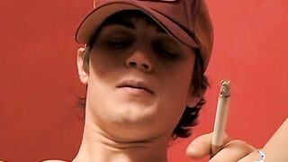 Dark haired Kevin masturbates after pushing dildo in own ass