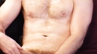 Buff amateur gay stroking his large cock before cumming