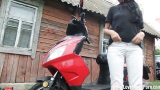Biker bimbos masturbates on her red motorcycle