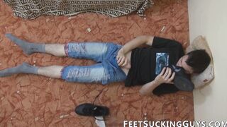 Skinny young man cleans shoes before jacking off with them