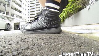 Teenage Asian redhead filmed while peeing on the street