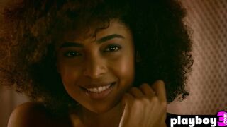Curly ebony model shows perfect body
