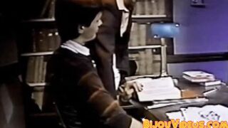 Nerdy college students blow each other in the library