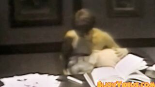 Nerdy college students blow each other in the library