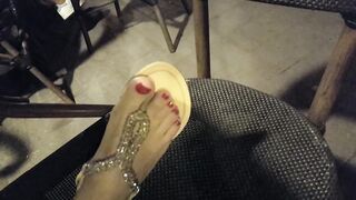 Lover shows sandals, pedicured hot toes red foot