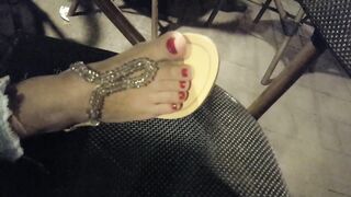 Lover shows sandals, pedicured hot toes red foot
