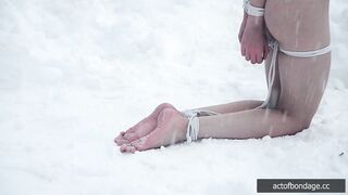Naked barefoot Greta tied up in the snow