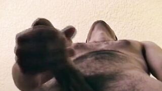 Hairy young guy tugs raging dick and cums all over the place